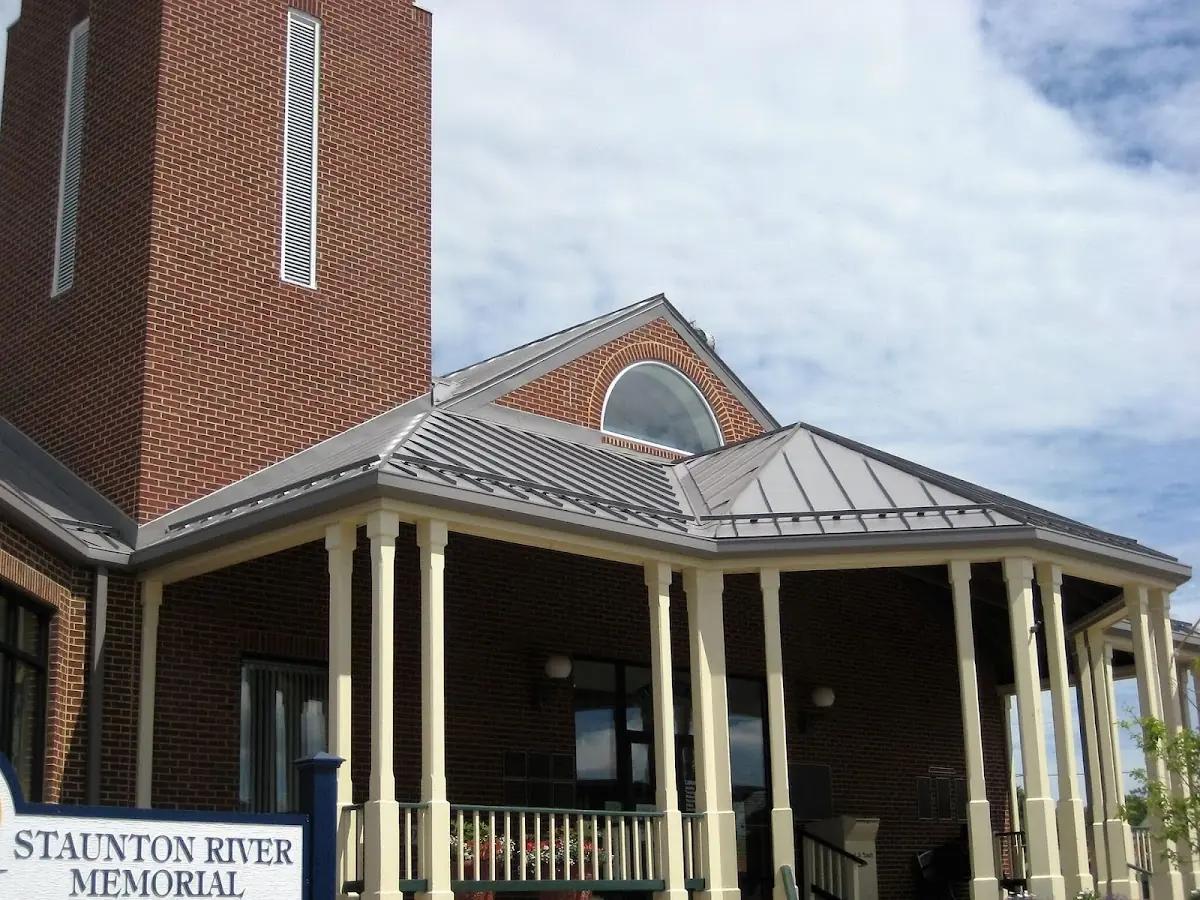 Skilled roofing craftsmen working on a residential roof in Broadview